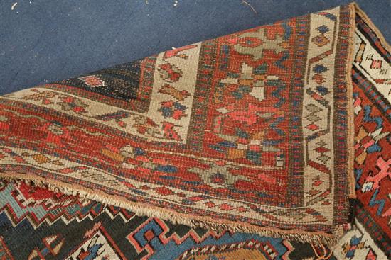 A Kazak blue ground runner, c.1880, 11ft 8in by 3ft 8in.